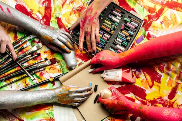Color hands. Great paints for pictures and for creative people. Different ways of using paints. Have fun drawing. Not stopping imagination. Art in all around. Opposite each other in inspiration.