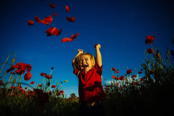 Happy summer. Child in poppy field. Kid with red flowers nature. Happy walk. — Stock Photo, Image