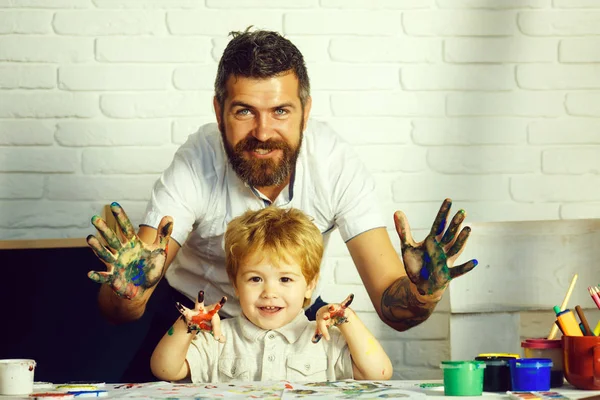 Happy family art. Colorful hands concept. Father and son friendship. Family weekend.