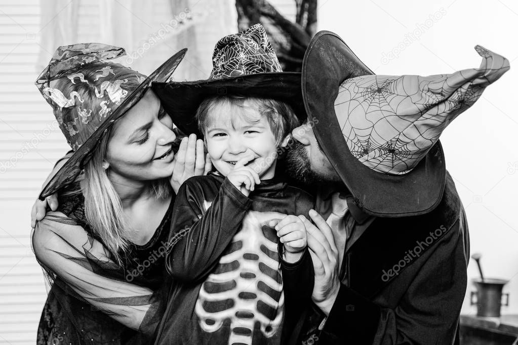 Autumn family love. Traditions for October 31. Mother, son and father celebrate Halloween. Holiday for Toddler. Happy family and vacation concept.