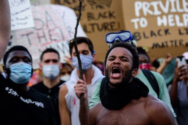 Miami Downtown, FL, USA - MAY 31, 2020: The voice of blacks. Activist on behalf of people with black skin. clipart