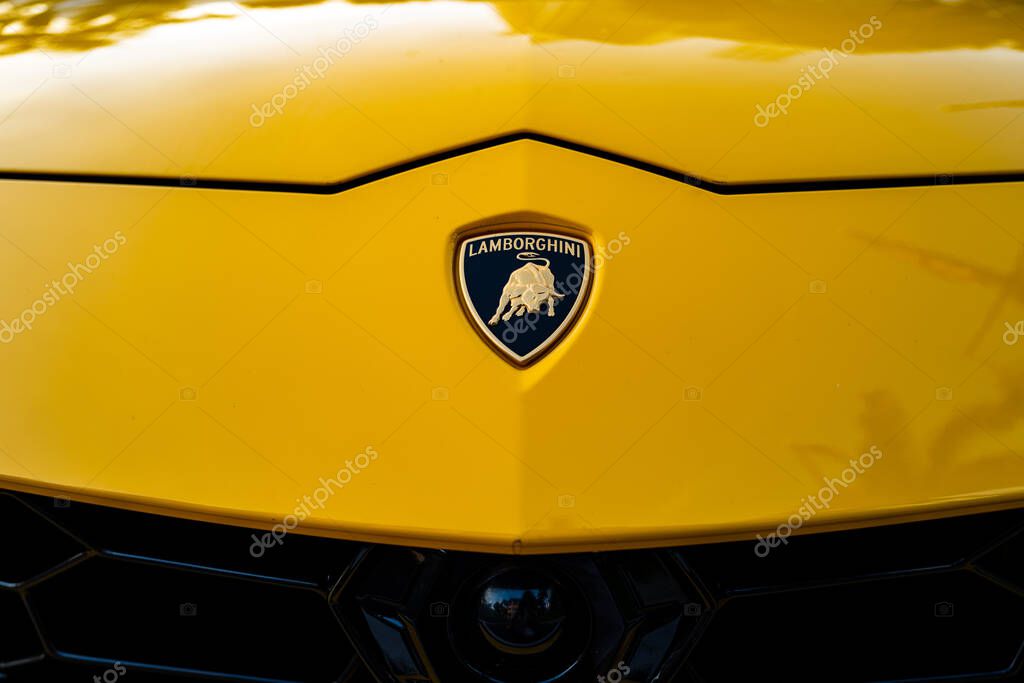 Miami, Florida, USA - JUNE 2020: Lamborghini logo. Yellow super car. Beautiful expensive car. Horsepower. Elegant transport Luxury life