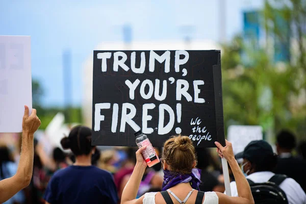 Orlando, FL, USA - JUNE 19, 2020: Trump, youre fired poster. Demonstration in the USA. Voters and politics. US President Donald Trump impeachment. Elections, election campaign. — Stock Photo, Image