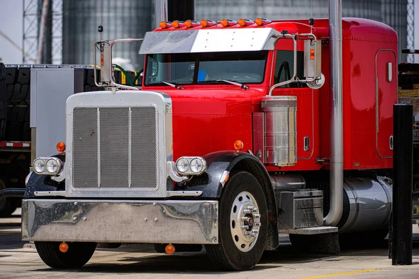 Big red truck. American style truck in the industrial aria. Transportation theme. Road cars theme. — Stock Photo, Image
