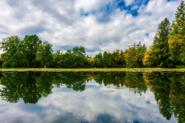 stock image clouds are reflected in the water of a mountain lake