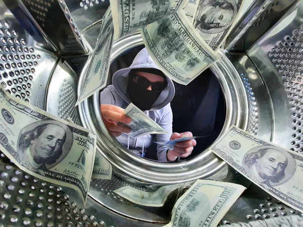 money laundering by a masked man in a washing machine