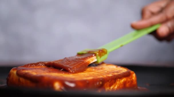 Slow Motion Closeup Barbecue Sauce Being Rubbed Cottage Cheese Steak — Stock Video