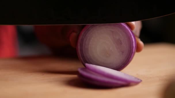 Slow Motion Closeup Sliding Truck Shot Onion Being Chopped Black — Stock Video