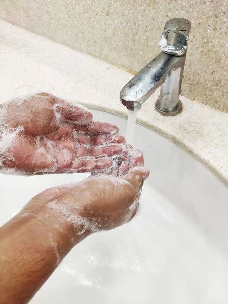 Handwashing with soap and water bubbles all over hands . — Stock Photo, Image