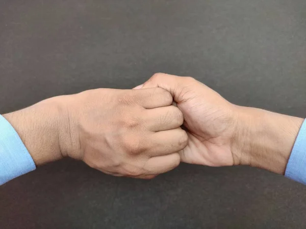 Hand holding Hand , support bonding togetherness Concept, black background — Stock Photo, Image