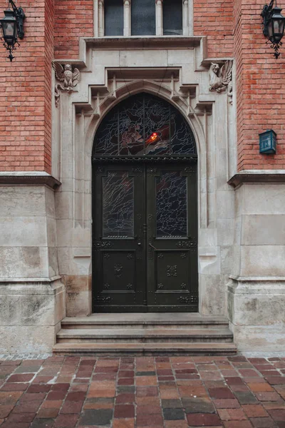 Vertical picture of old architecture door with brick wall outdoor europe