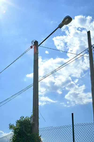 utility poles with sky in the background