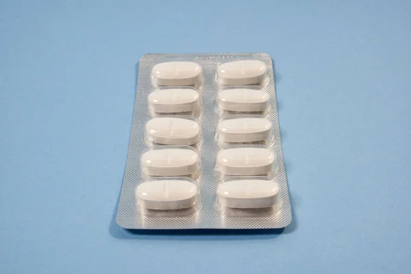 mavi arkaplanlı ambalajlarında haplar