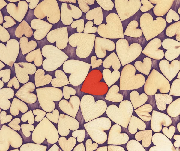 little wood heart  on wood background, valentine day concept with selective red heart  area , one love
