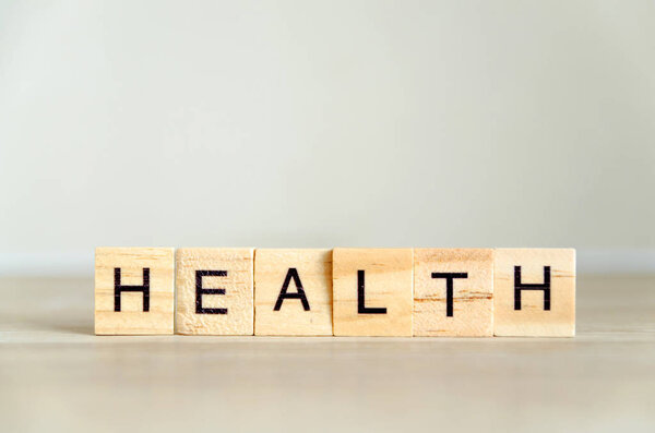 фон слова здоровья на деревянных блоках
