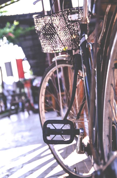 Detail of a Vintage Bicycle Travel Resting in the city Street