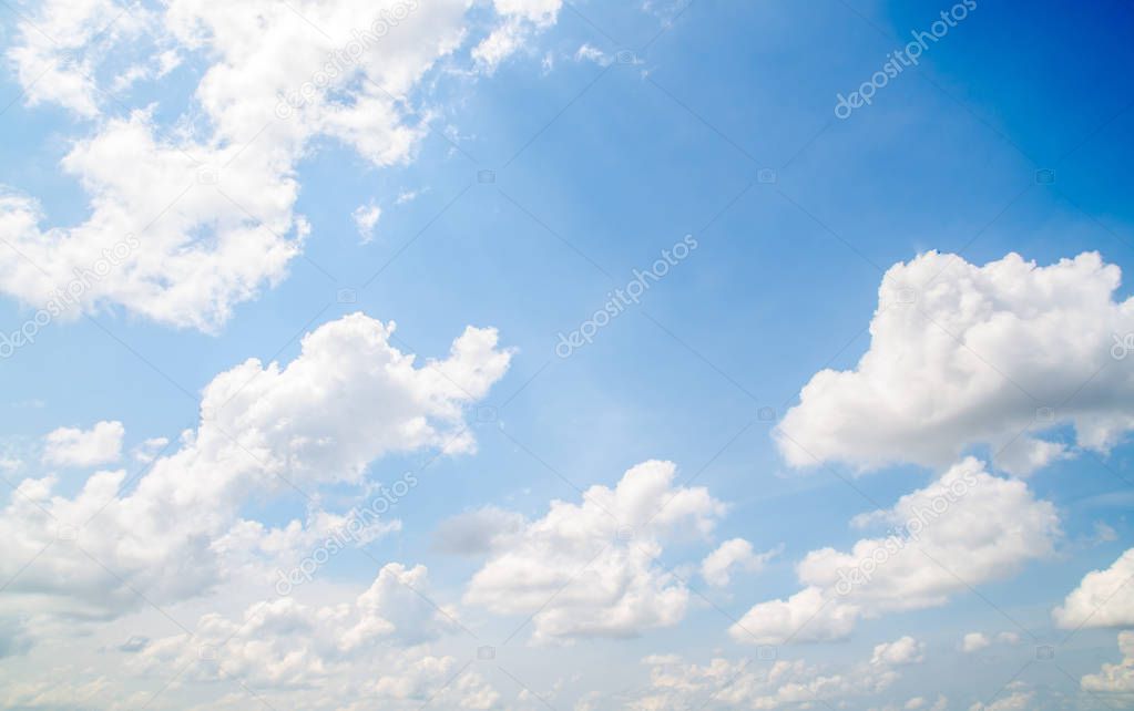 white fluffy clouds in the blue sky