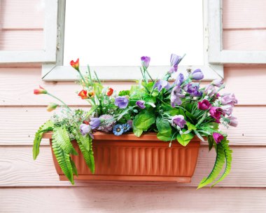 jardiniere on window with pink wood background  and plastic flower clipart