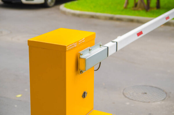 Security system for building access - barrier gate stop with toll booth, traffic cones and cctv