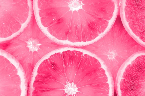신선하게 썰어 진 분홍색 과일 질감. 매크로, 맨 위 뷰 복사 공간. 쥬스 오렌지의 배경. — 스톡 사진