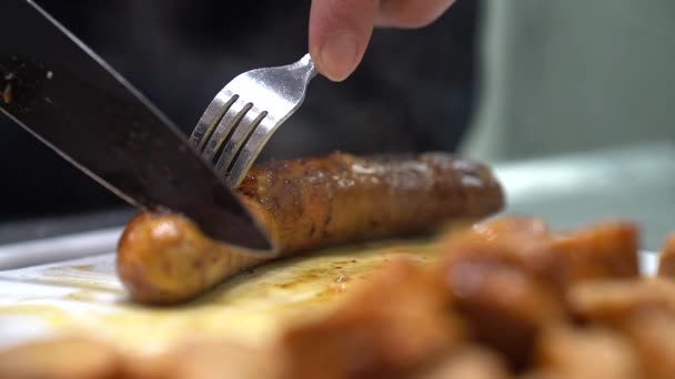 Large Sausages Barbecued Slow Motion Cut Knife Fork Kitchen Steam — Stock Video