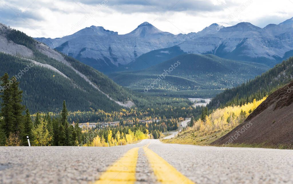 Alberta Route 66 looking into the kananaskis mountain valley with autumn colours.