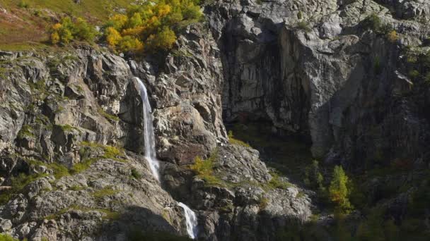 Slow motion aerial shot of big splashing waterfall in summer georgia — Stock Video