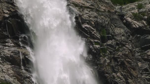Slow motion shot of waterfall flowing down the rock. — Stock Video