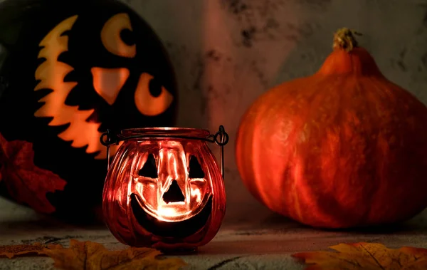 Burning candles, pumkin, ball, leaves for halloween Stock Picture