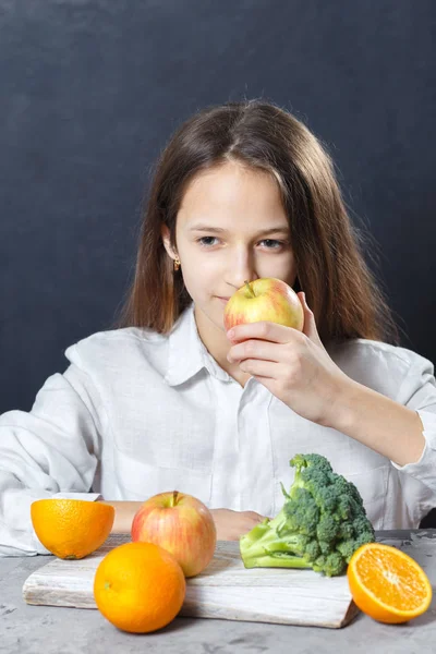 Health teen girl sniffing apple with smile face, health food concept
