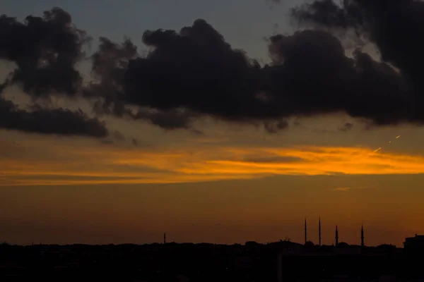 Sunset sky with dark shadow of city,close up taken.