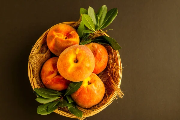 Fresh Ripe Peaches Wicker Basket Dark Surface Copy Space View — Stock Photo, Image