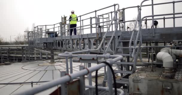 Industrial worker using a digital tablet on site — Stock Video