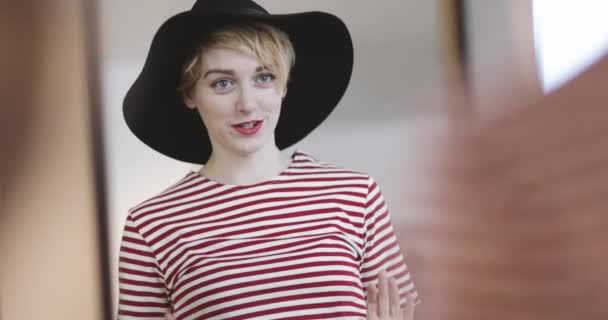 Young adult female trying on clothes in a vintage store — Stock Video