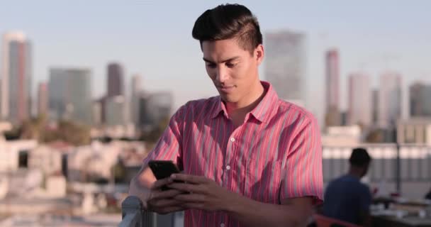 Young Adult Male Messaging Friend Rooftop Party — Stock Video