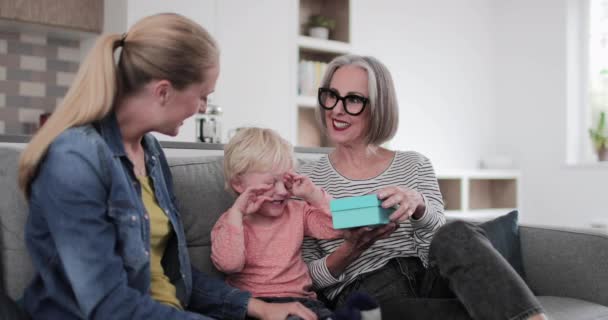 Grandchild Giving Grandmother Present — Stock Video