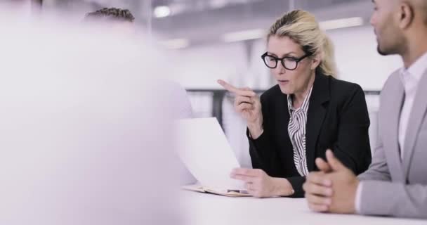 Female business executive leading a meeting — Stock Video