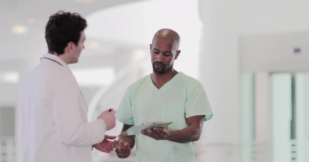 Doctor signing forms in hospital — Stock Video