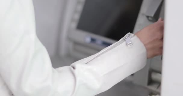 Closeup of woman using an ATM — Stock Video