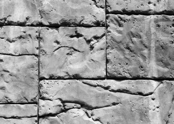 Gotisk bakgrund med tegelvägg av stenar. Sprickor och repor — Stockfoto