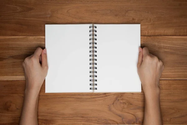 Female Hands Hold Blank Book Wood Desk Table Top View — Stock Photo, Image