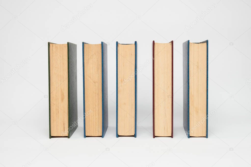 books in a row, isolated on white background