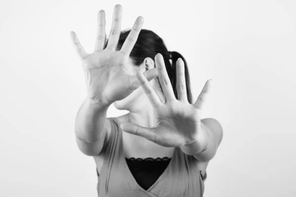 Young woman showing her denial with NO on her hand — Stock Photo, Image
