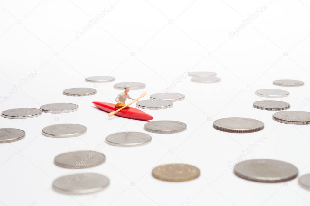 a man is on Kayak surround by the coins