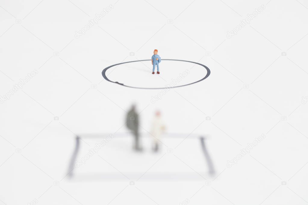 miniature family over a white background