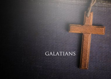 A cross with Bible book of galatians clipart