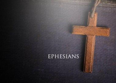 A cross with Bible book of ephesians clipart
