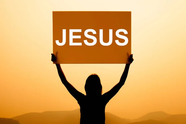 Bir gündoğumu arka plan ile İsa işareti — Stok fotoğraf