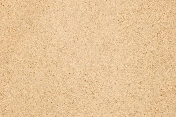 Піщана текстура. Коричневий пісок. Фон з дрібного піску . — стокове фото