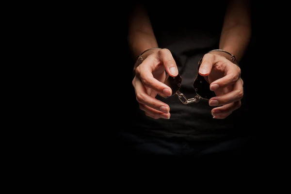 Concept human trafficking,hand girl in shackle on isolate black background — Stock Photo, Image